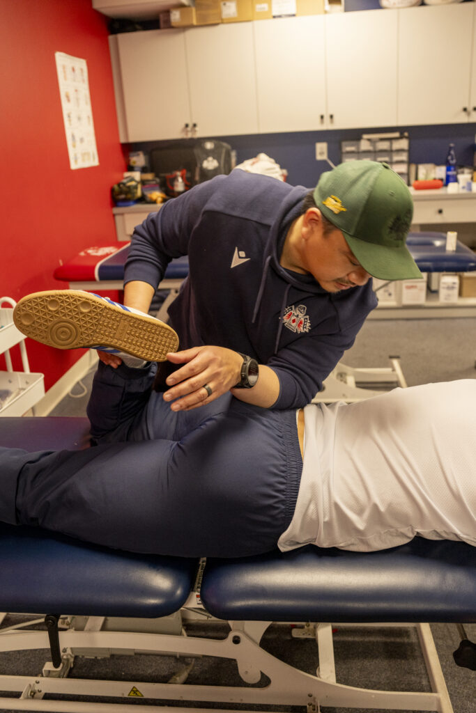 Manual Glute Medius release on a Professional Athlete