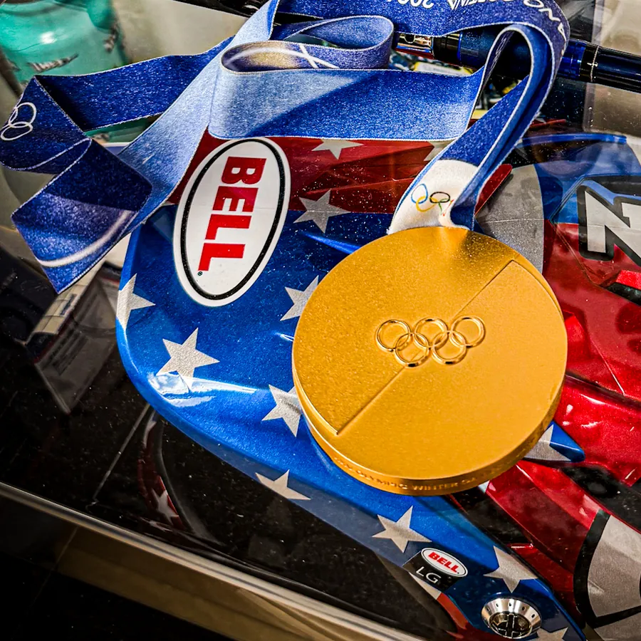 Olympic gold medal from the 2026 Milano Cortina Winter Olympics, displayed at Mui Chiropractic